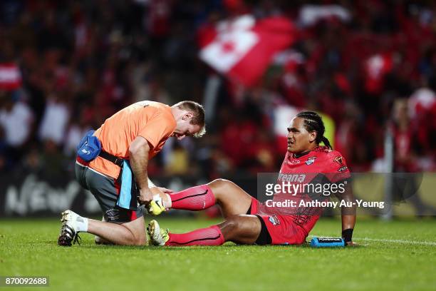 Solomone Kata of Tonga receives medical attention during the 2017 Rugby League World Cup match between Samoa and Tonga at Waikato Stadium on November...