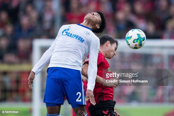 Weston McKennie of Schalke jumps for a header with Nicolas Hoefler of Freiburg during the Bundesliga match between Sport-Club Freiburg and FC Schalke...