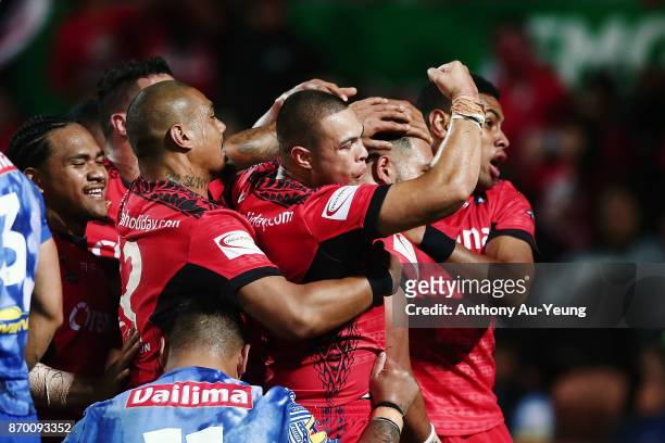Tuimoala Lolohea of Tonga celebrates teammate Ben Murdoch-Masila's try during the 2017 Rugby League World Cup match between Samoa and Tonga at...