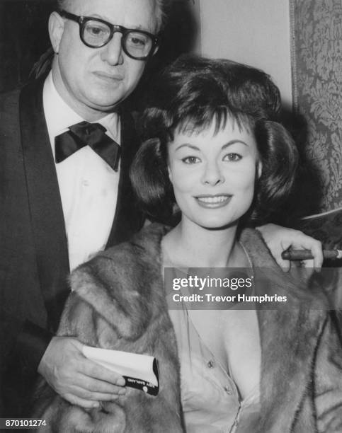 British actress Anne Heywood attends the premiere of the Judy Garland film 'I Could Go On Singing' at the Plaza cinema in London, with her husband,...