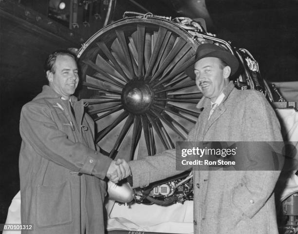 John Harvey Heyworth , the Chief Test Pilot of Rolls-Royce, shakes hands with Alvin M. Johnston, aka Tex Johnston , Chief Test Pilot of Boeing...