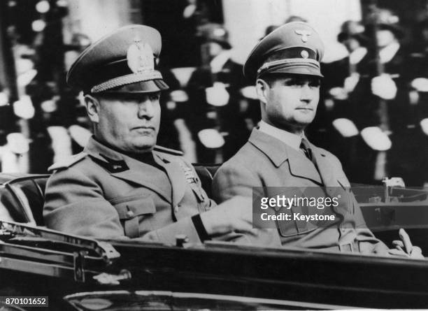 Nazi Party official Rudolf Hess in a car with Italian leader Benito Mussolini, circa 1938.