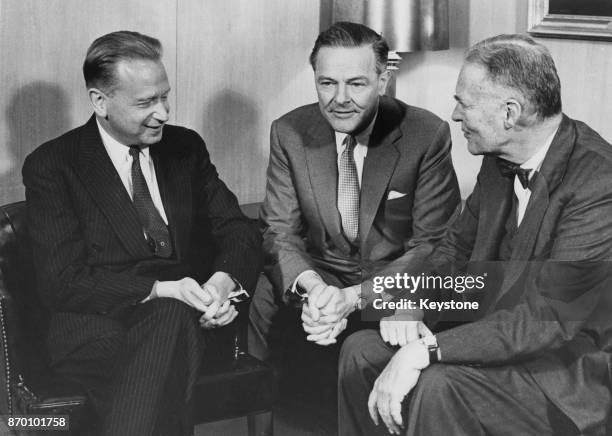 Dag Hammarskjöld , the Secretary-General of the United Nations, holds a meeting in the Diplomatic Section Room of the State Department in Washington,...