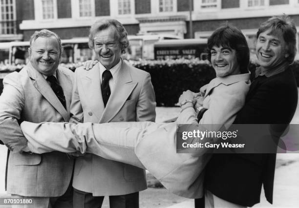 From left to right, British singers and musicians Harry Seycombe, Bert Weedon and Vince Hill hold up Bobby Crush at the launch of the new record...