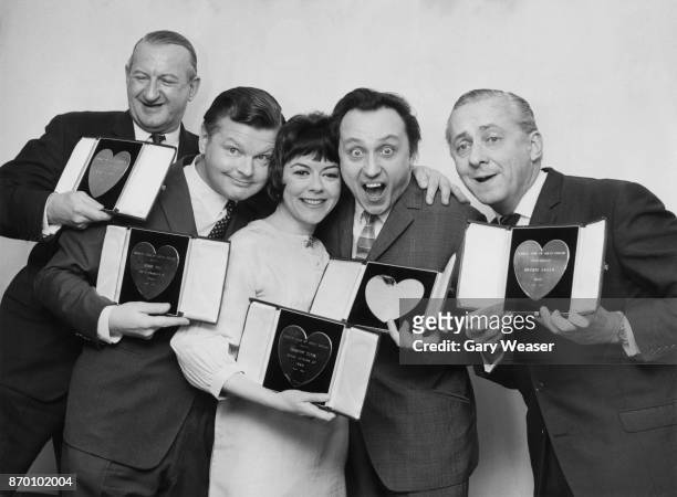 From left to right, Michael Miles, Benny Hill, Dorothy Tutin, Ken Dodd and Hughie Green with their silver hearts at the Variety Club of Great Britain...
