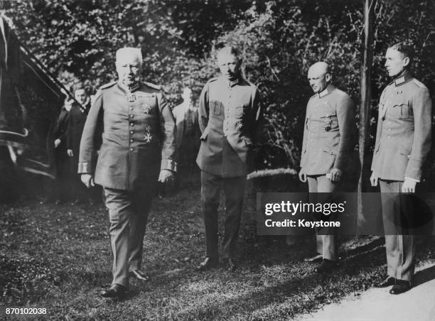 President of the German Reich Paul von Hindenburg watching German military manoeuvres at Bad Mergentheim, Germany, with his son and aide-de-camp...