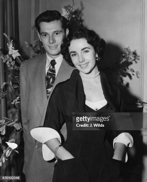 Actress Elizabeth Taylor and her husband Conrad Hilton Jr. Aka Nicky Hilton, arrive in the Bridal Suite at the Savoy Hotel in London, 10th June 1950....