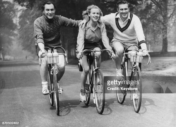 From left to right, actors Patrick Holt, Honor Blackman and John McCallum, the stars of the new Gainsborough Pictures film 'Wheels Within Wheels' ,...