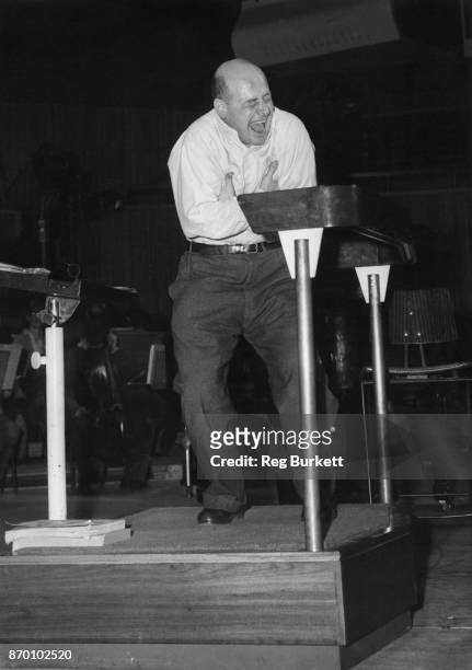 Musician and comic Gerard Hoffnung conducts an orchestral rehearsal, 21st November 1958.