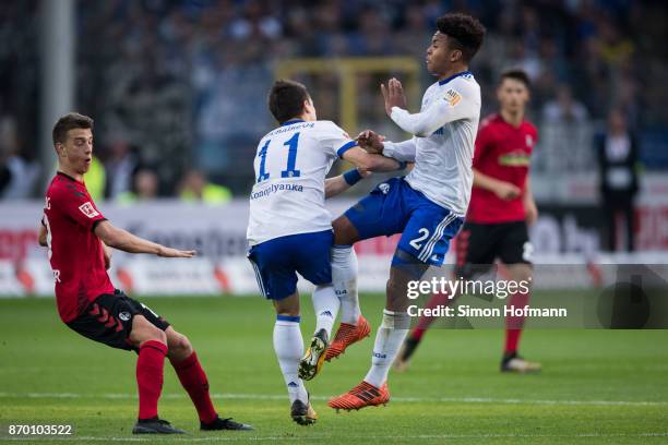 Yevhen Konoplyanka of Schalke gets injured a he gets hit by team mate Weston McKennie during the Bundesliga match between Sport-Club Freiburg and FC...