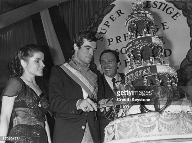 French cyclist Bernard Hinault cuts the cake at a reception in Paris to celebrate his 25th birthday, 15th November 1979. Hinault won the Tour de...