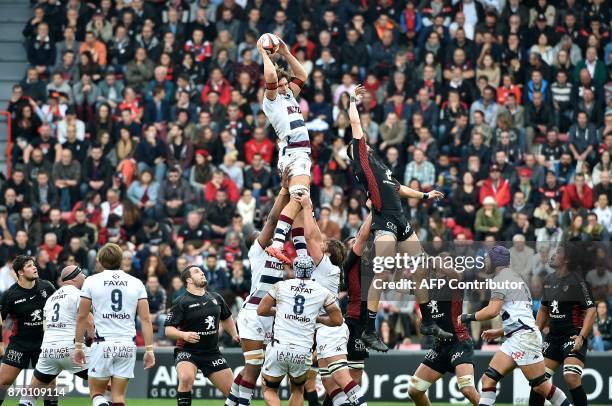 Bordeaux's flanker Luke Jones grabs the ball in a line out during the French Top 14 rugby union match between Toulouse and Bordeaux-Begles, at Ernest...