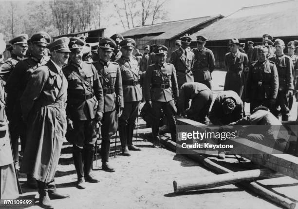 German Chancellor Adolf Hitler watches men at work in a military camp at St Polten near Vienna, during a tour of Austria, April 1939.