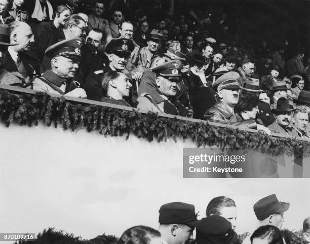 From right to left, German Chancellor Adolf Hitler , General Werner von Blomberg, Joseph Goebbels and General Werner von Fritsch watch the final ski...