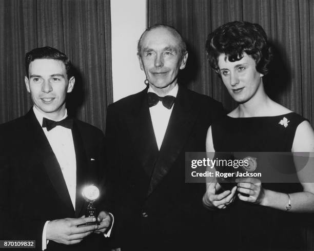 From left to right, racing driver Jim Clark , British Prime Minister Alec Douglas-Home and sprinter Dorothy Hyman, at the annual dinner of the Sport...