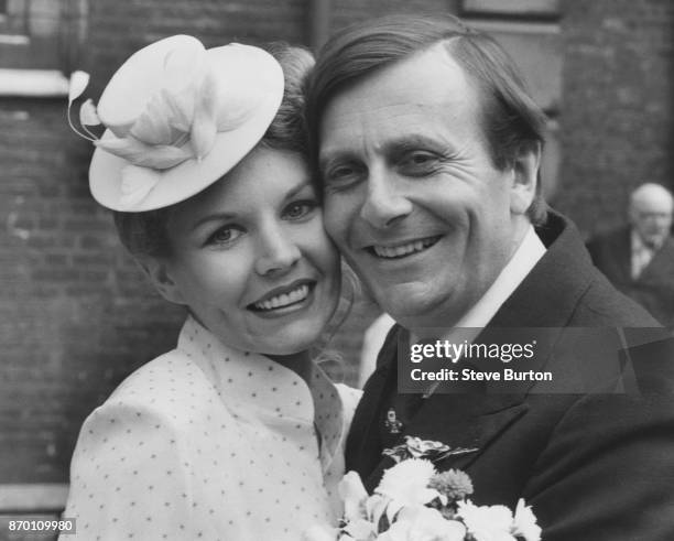 Australian comedian Barry Humphries, known for his alter ego Dame Edna Everage, marries artist Diane Millstead at St James' Piccadilly, London, 16th...