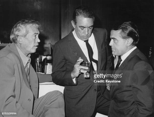 From left to right, film director John Huston, actor Anthony Quinn and Jack Valenti, president of the MPAA , during a visit by Valenti to the De...