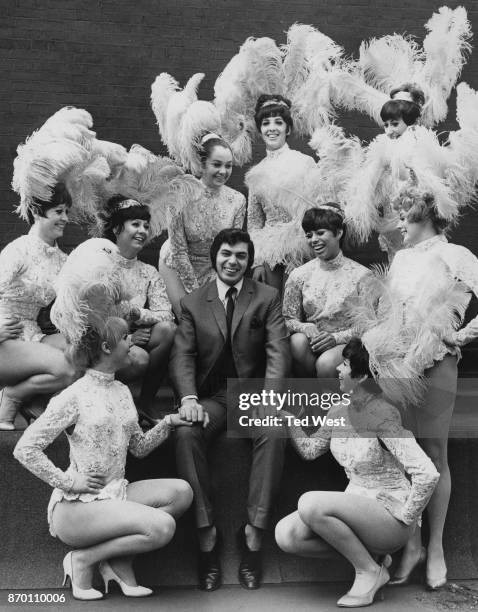 English singer Engelbert Humperdinck with nine female performers from his show 'Robinson Crusoe' at the London Palladium, UK, 8th April 1968. They...