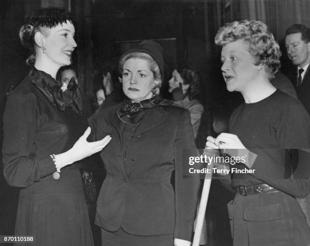 From left to right, English actresses Valerie Hobson, Hermione Baddeley and Dora Bryan during rehearsals for the show 'Midnight Cavalcade' at the...