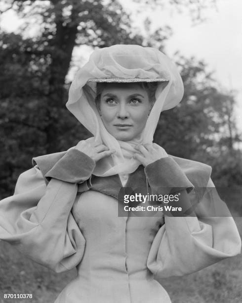 Australian actress Diane Cilento in Edwardian costume for the film 'The Truth About Women' at Shepperton Studios, UK, May 1957.
