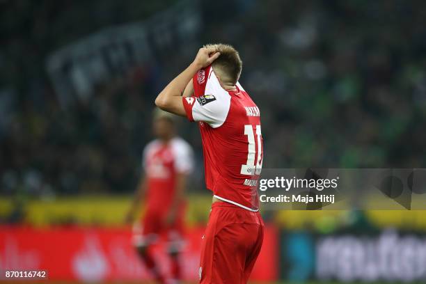 Alexandru Maxim of Mainz covers his face during the Bundesliga match between Borussia Moenchengladbach and 1. FSV Mainz 05 at Borussia-Park on...