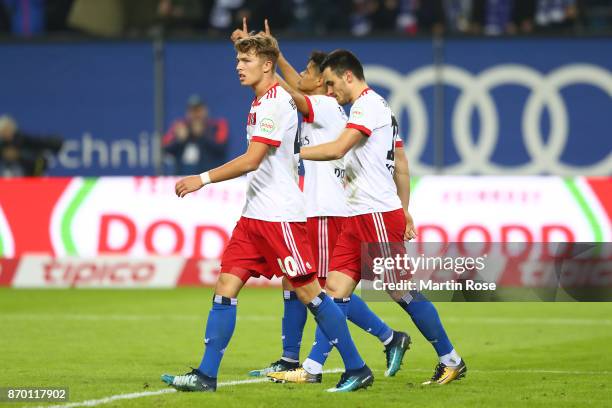 Jann-Fiete Arp of Hamburg, Douglas Santos of Hamburg and Filip Kostic of Hamburg celebrate after Kostic scored a goal to make it 2:1 during the...