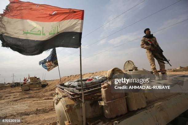 Iraqi forces hold a position on November 4, 2017 near the Syrian border after recapturing the border town of Qaim, west of Anbar, from the Islamic...