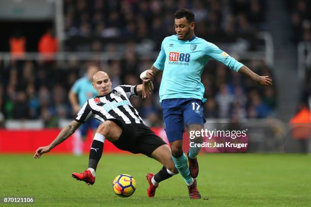 Jonjo Shelvey of Newcastle United and Joshua King of AFC Bournemouth in action during the Premier League match between Newcastle United and AFC...