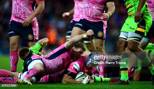 Toby Salmon of Exeter Chiefs goes over for a try as Will Chudley of Exeter Chiefs celebrates during the Anglo-Welsh Cup match between Exeter Chiefs...