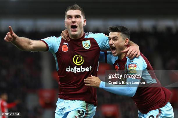 Sam Vokes celebrates scoring his side's first goal with Matthew Lowton of Burnley during the Premier League match between Southampton and Burnley at...