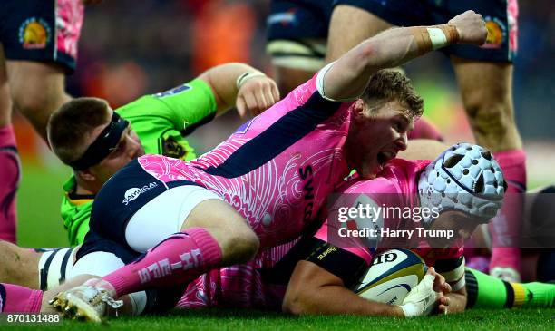 Toby Salmon of Exeter Chiefs goes over for a try as Will Chudley of Exeter Chiefs celebrates during the Anglo-Welsh Cup match between Exeter Chiefs...