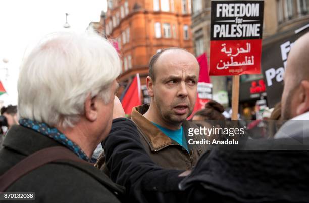 Protester reacts against pro-Palestinian supporters during a national march through central London, England, on November 4, 2017 as they demand...