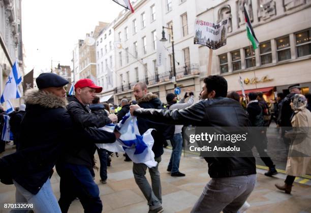 Brawl breaks out between Israeli protesters and pro-Palestinian supporters during a national march through central London, England, on November 4,...