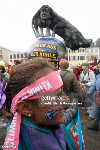Big demonstration on the occasion of the UN Climate Conference in Bonn. Young girl from the Fiji islands with tatoo "Planet Earth First".