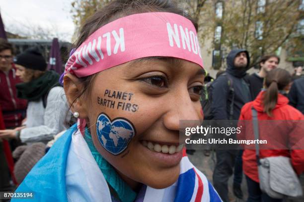 Big demonstration on the occasion of the UN Climate Conference in Bonn. Young girl from the Fiji islands with tatoo "Planet Earth First".