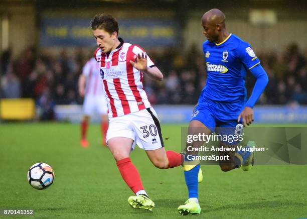 Lincoln City's Alex Woodyard shields the ball from AFC Wimbledon's Nadjim Abdou during the Emirates FA Cup First Round match between A.F.C. Wimbledon...