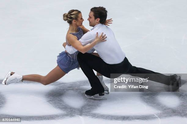 Kristen Moore-Towers and Michael Marinaro of Canada perform during the Pairs Free Skating on Day 2 of Audi Cup of China ISU Grand Prix of Figure...