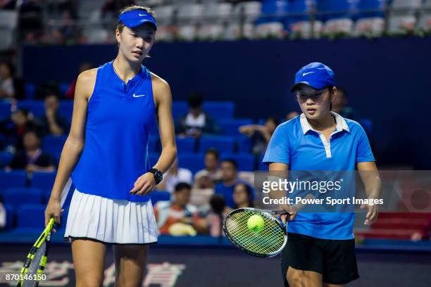 Jing Xinyu Jiang and Qianhui Tang of China talk during the doubles Round Robin match of the WTA Elite Trophy Zhuhai 2017 against Jing-Jing Lu and...
