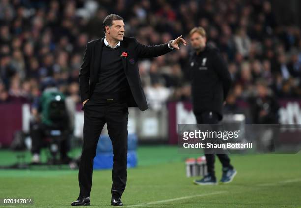 Slaven Bilic, Manager of West Ham United gives his team instructions during the Premier League match between West Ham United and Liverpool at London...