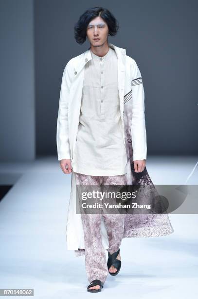 Model showcases designs on the runway at the XINSHEN LINEN fashion show by designer Sun Lin during the Mercedes-Benz China Fashion Week Spring/Summer...