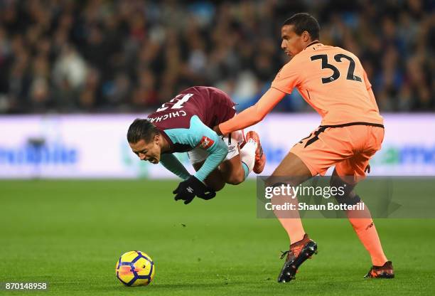 Javier Hernandez of West Ham United and Joel Matip of Liverpool in action during the Premier League match between West Ham United and Liverpool at...