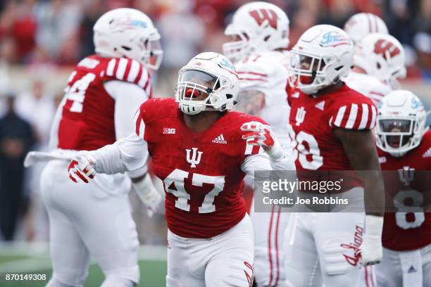 Robert McCray III of the Indiana Hoosiers reacts after a sack against the Wisconsin Badgers in the first quarter of a game at Memorial Stadium on...