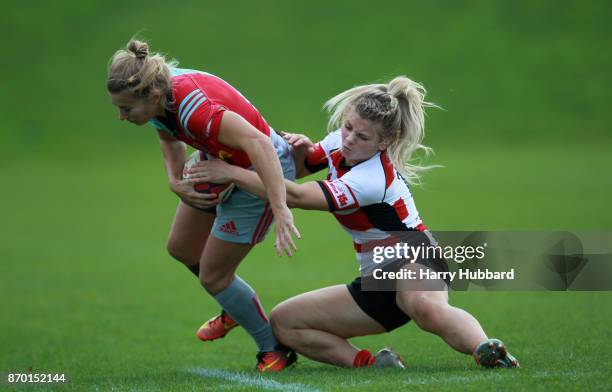 Fiona Pocock of Harlequins Ladies and Ffion Lewis of Gloucester-Hartpury Woman's RFC in action during the Tyrrells Premier 15s match between...