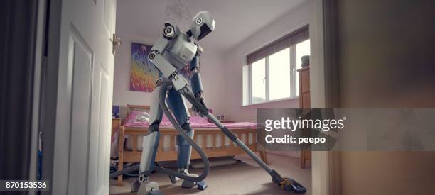 robot doing household cleaning with vacuum cleaner - robot stock pictures, royalty-free photos & images