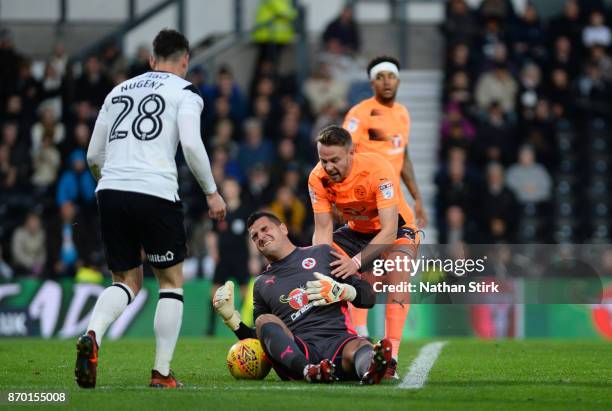 Vito Mannone of Reading goes down injured during the Sky Bet Championship match between Derby County and Reading at iPro Stadium on November 4, 2017...