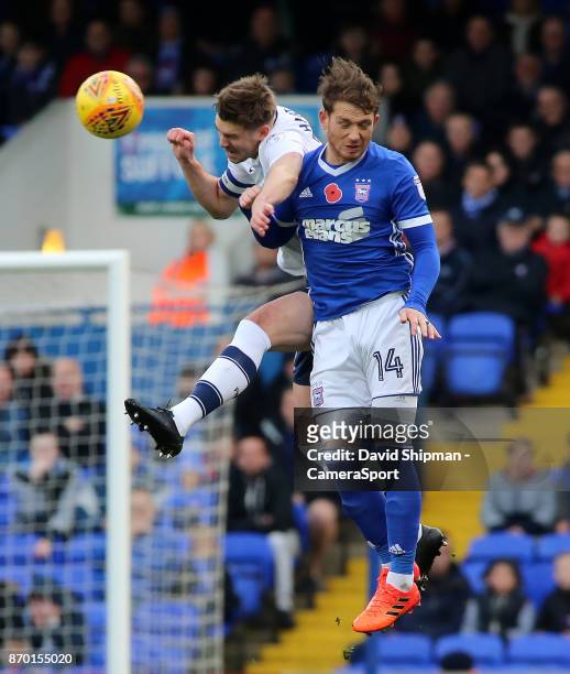 Preston North End's Paul Huntington heads clear from Ipswich Town's Joe Garner during the Sky Bet Championship match between Ipswich Town and Preston...