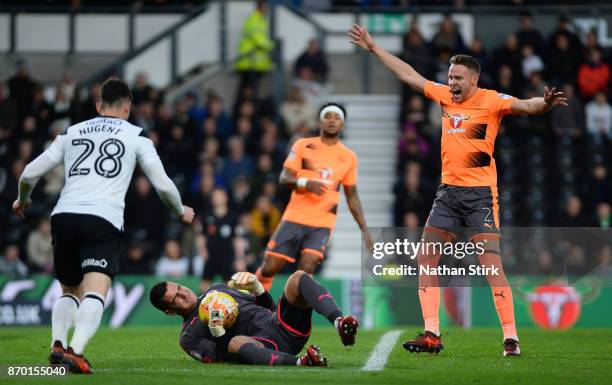 Vito Mannone of Reading goes down injured during the Sky Bet Championship match between Derby County and Reading at iPro Stadium on November 4, 2017...