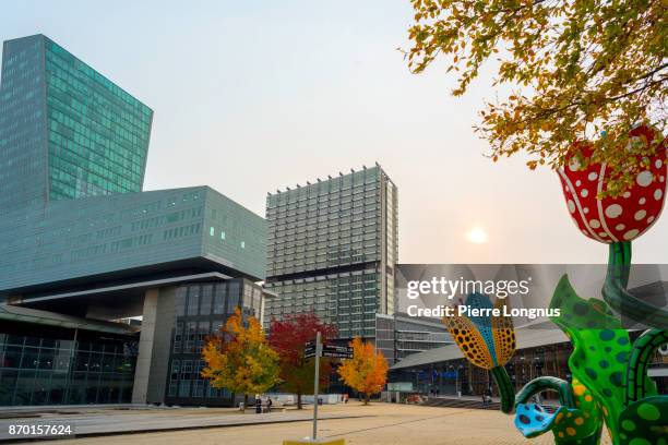 sunset on the shangri-la tulips monument in the center of the esplanade françois mitterrand, euralille business district and buildings, lille, north of france - lille stock pictures, royalty-free photos & images