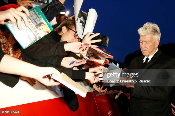 David Lynch signs autographs as he walks red carpet during the 12th Rome Film Fest at Auditorium Parco Della Musica on November 4, 2017 in Rome,...