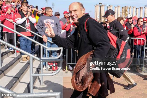 Head coach Mike Riley of the Nebraska Cornhuskers greets fans before the game against the Northwestern Wildcats at Memorial Stadium on November 4,...